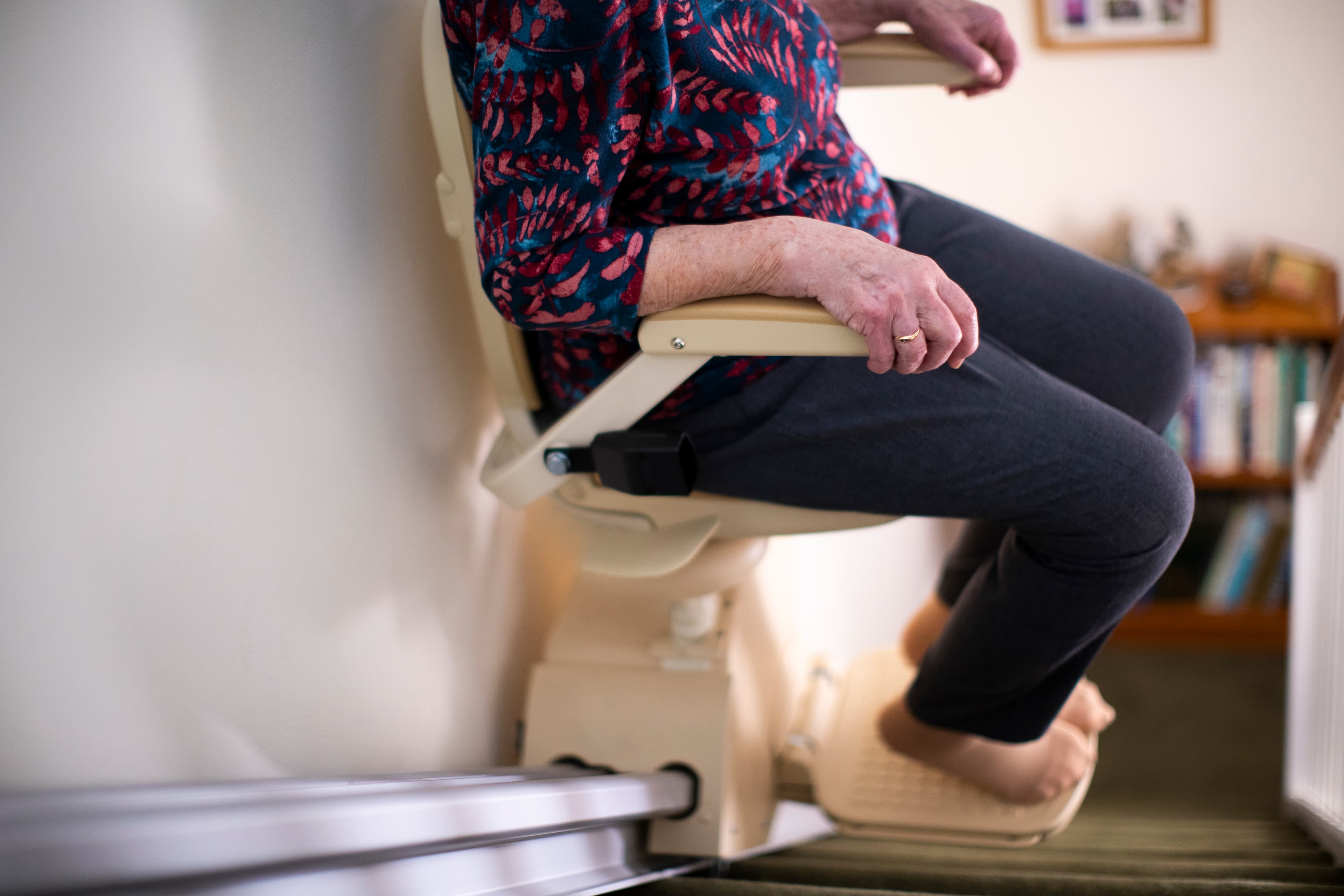 Elderly lady on stairlift